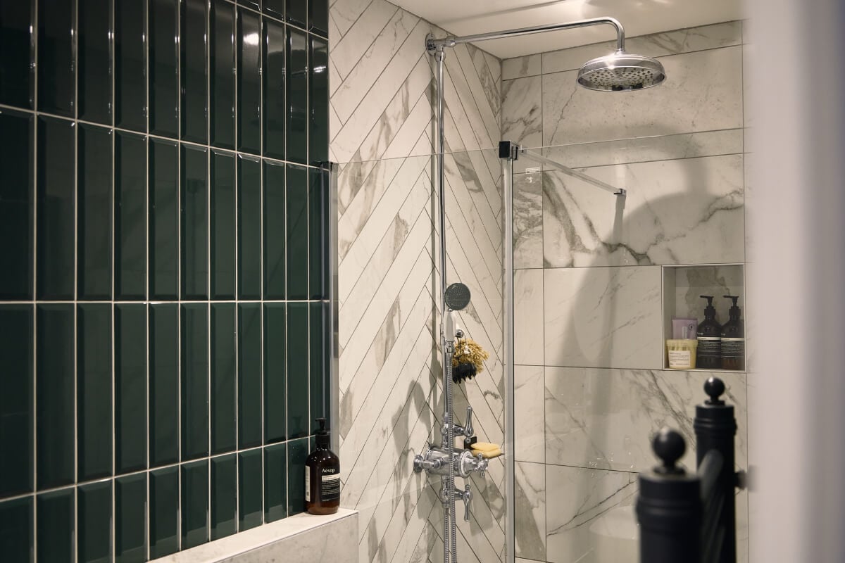Moody Tones in a Restored and Extended Victorian Home in London 29 bathroom marble and green tiles
