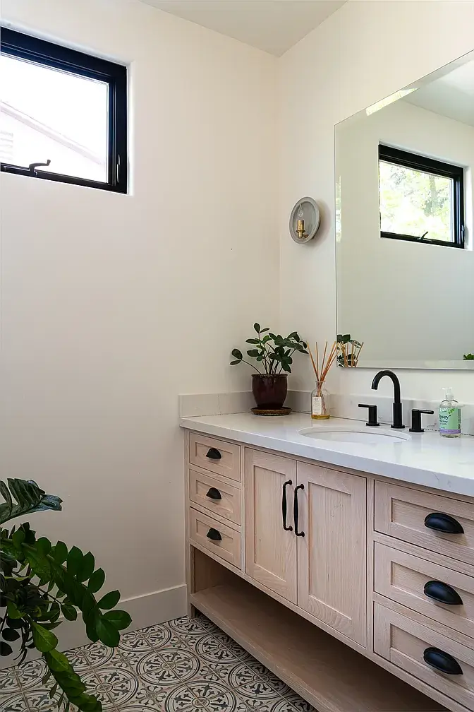 A Creative Sanctuary in Sherman Oaks Designed by Mendy Cheng 27 bathroom patterned tiles black fittings