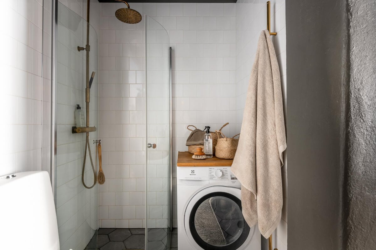A Blue Studio Apartment with Unique Stucco and Site-Built Storage 18 bathroom shower brass fittings
