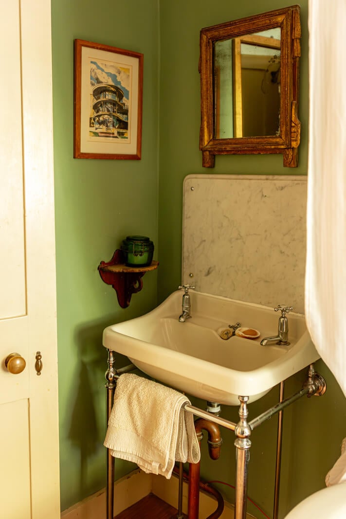 A Carefully Restored Georgian Townhouse in East London 24 bathroom sink marble backsplash