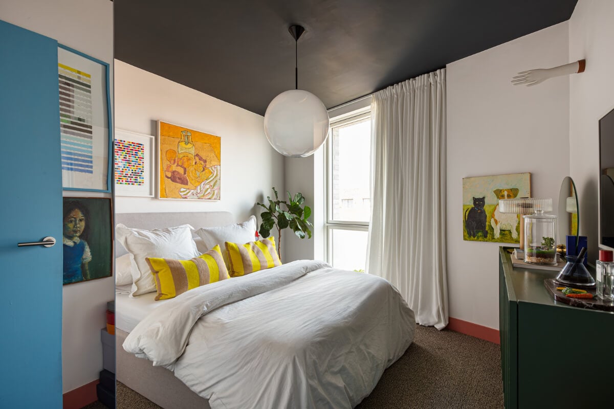 Playful Colors in a Modern One-Bedroom Apartment in London 18 bedroom black ceiling