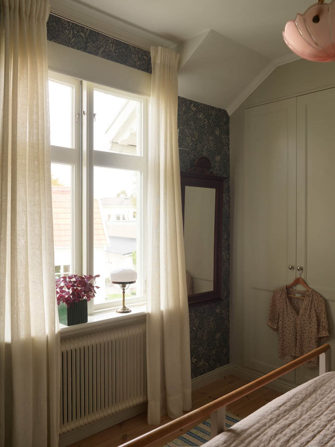 Light-Filled Rooms and Wallpapers in a Swedish Country House 19 bedroom blue floral wallpaper built-in wardrobes