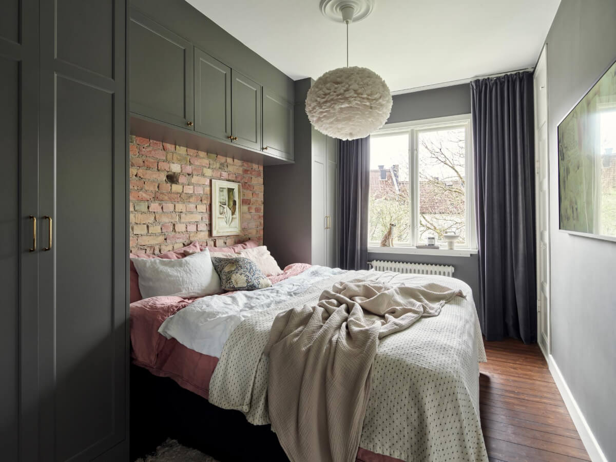 A Harmonious Color Palette in a Swedish Duplex Apartment 13 bedroom built-in wardrobes around bed exposed brick