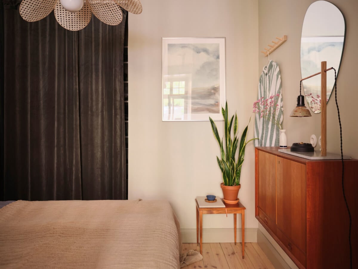 A Fantastic Small Art Nouveau Apartment in Stockholm 14 bedroom floating wooden cabinets wardrobes behind velvet curtai nordroom