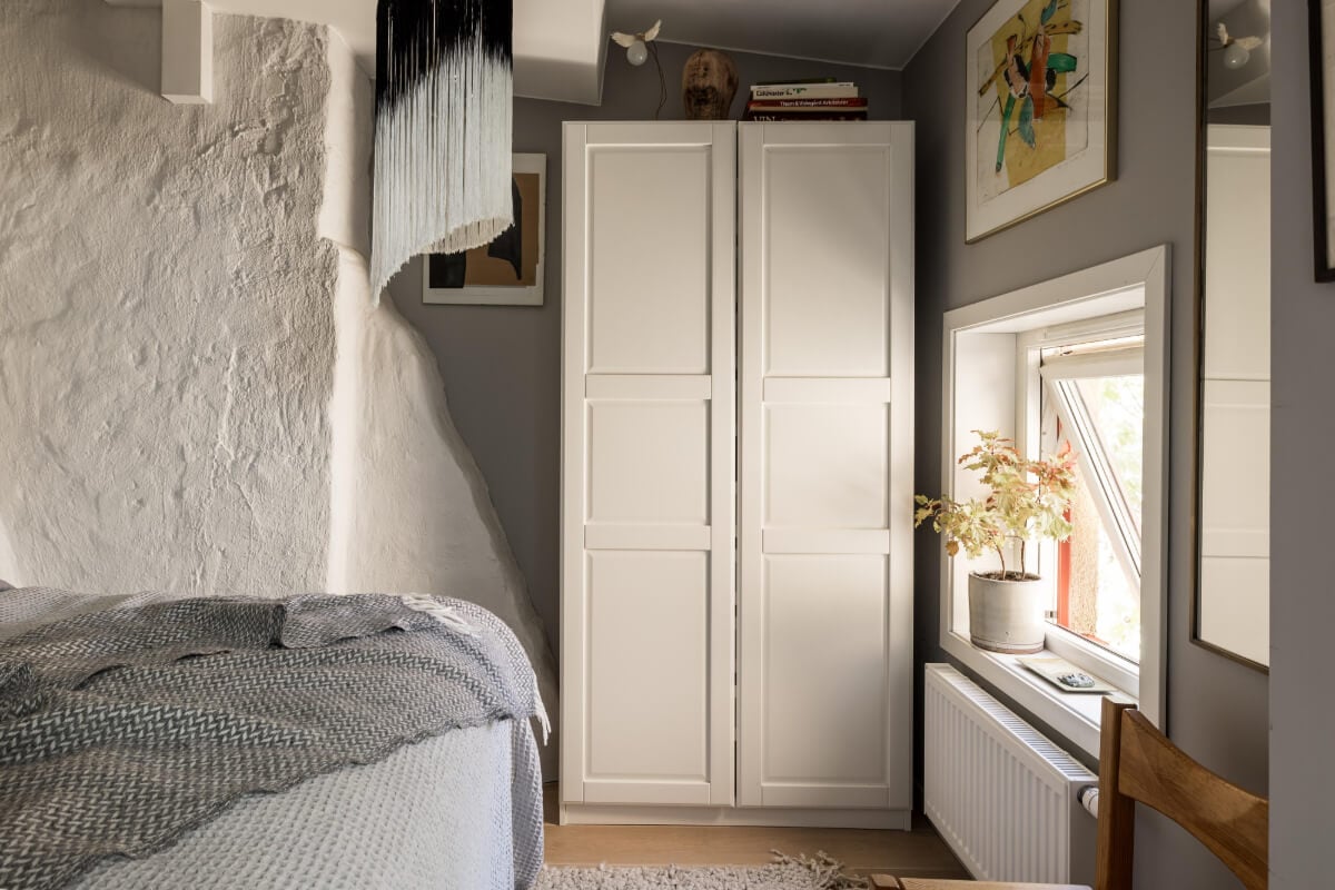 A Small, Cozy Attic Apartment with a Large Terrace 9 bedroom white stone wall