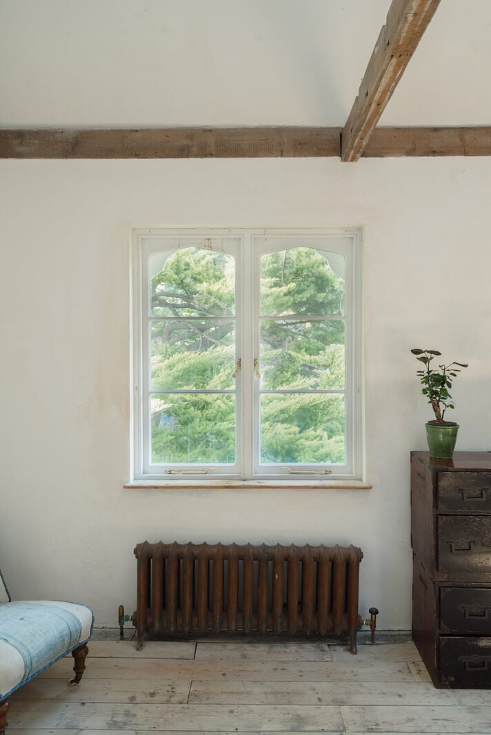Grand, Light-Filled Spaces in a Gothic-Style English Coastal Home 16 bedroom window