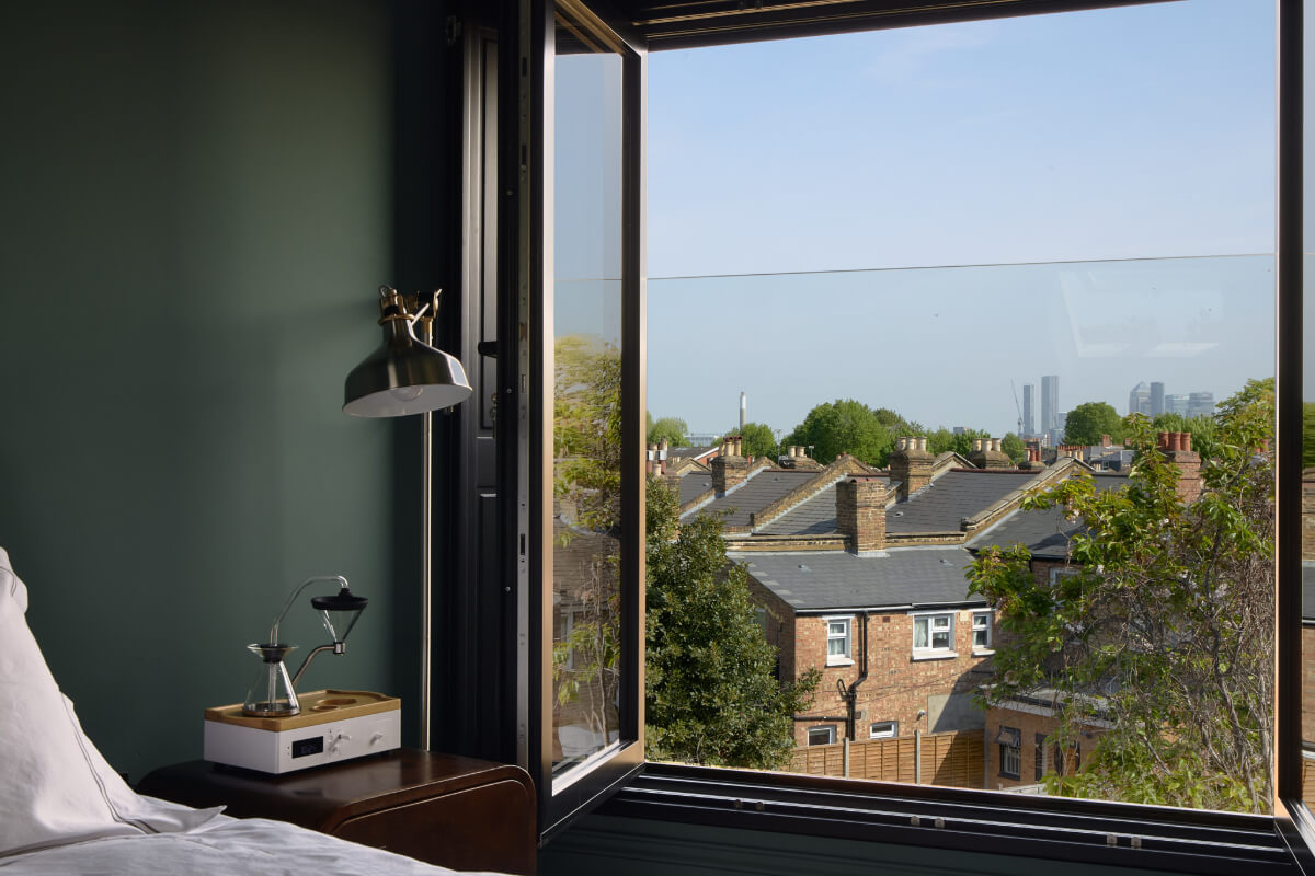 Moody Tones in a Restored and Extended Victorian Home in London 18 bedroom window view