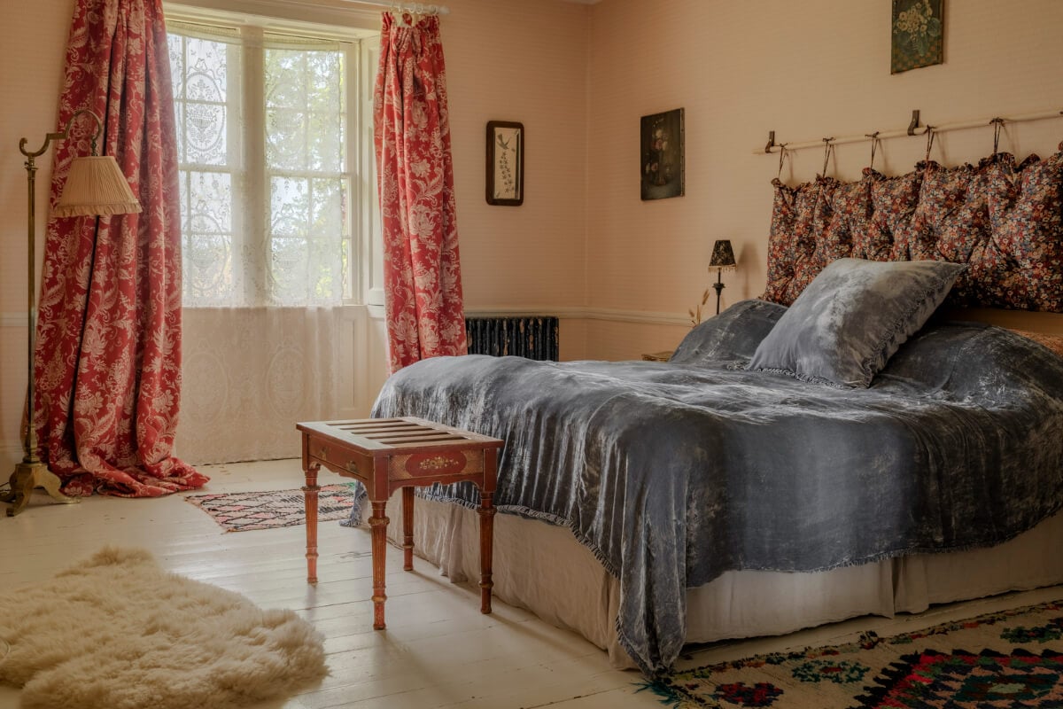 Pearl Lowe and Danny Goffey’s Eclectic Gothic Somerset Home Is For Sale 16 beige pink walls bedroom white floorboards
