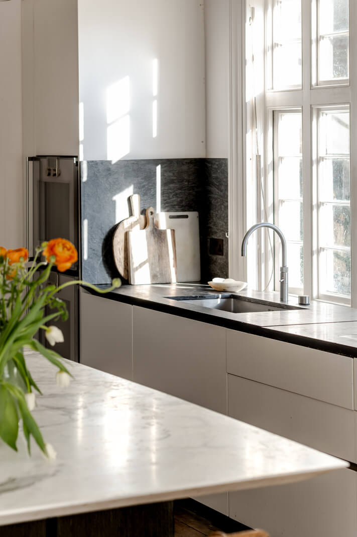 Grand, Light-Filled Spaces in a Gothic-Style English Coastal Home 8 black and white kitchen