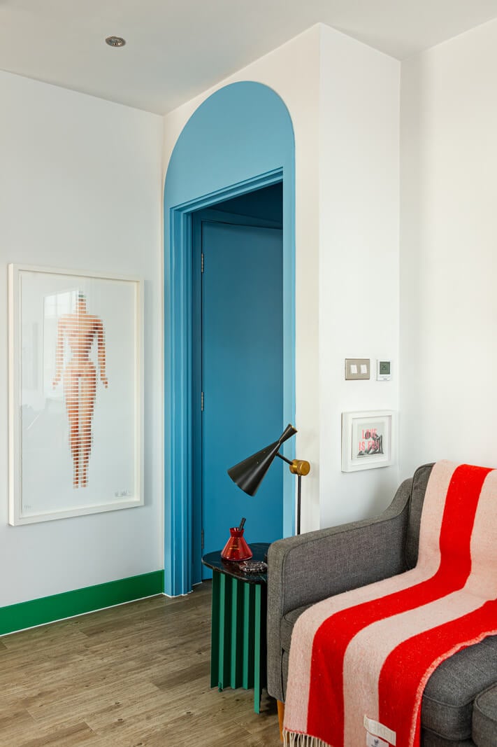 Playful Colors in a Modern One-Bedroom Apartment in London 15 blue doorway