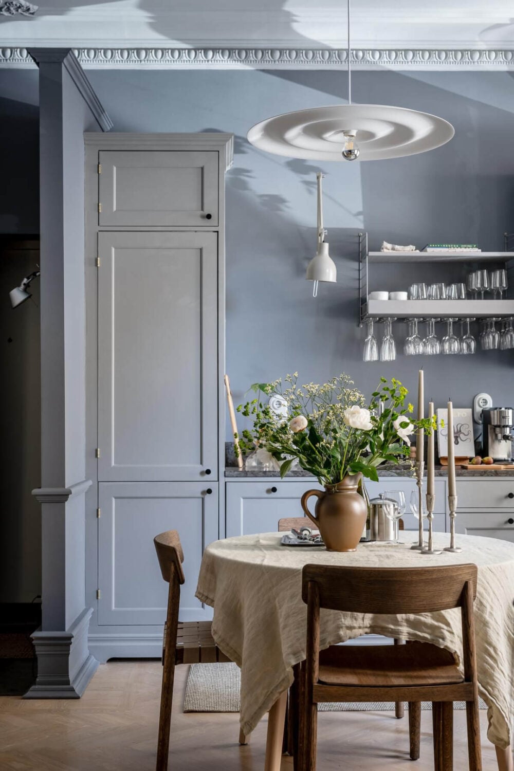 A Blue Studio Apartment with Unique Stucco and Site-Built Storage 4 blue-gray walls and kitchen studio apartment