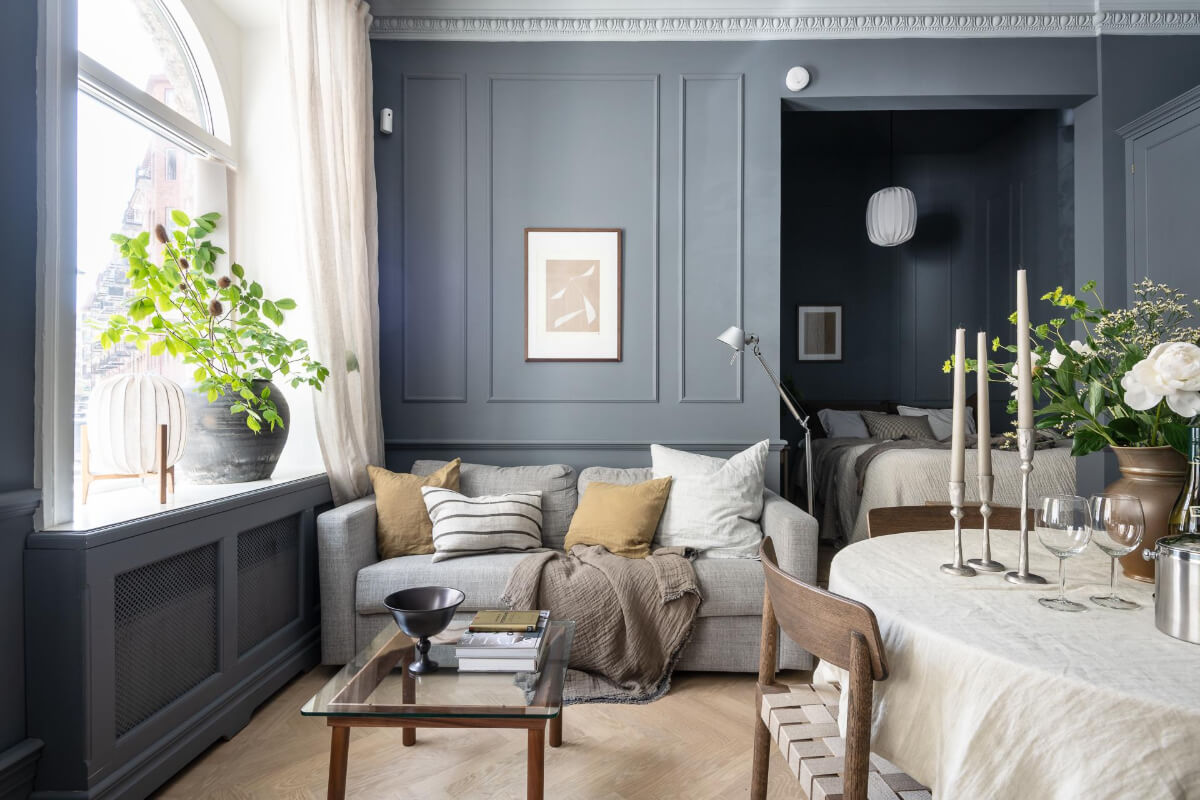 A Blue Studio Apartment with Unique Stucco and Site-Built Storage 9 blue gray walls paneling studio apartment