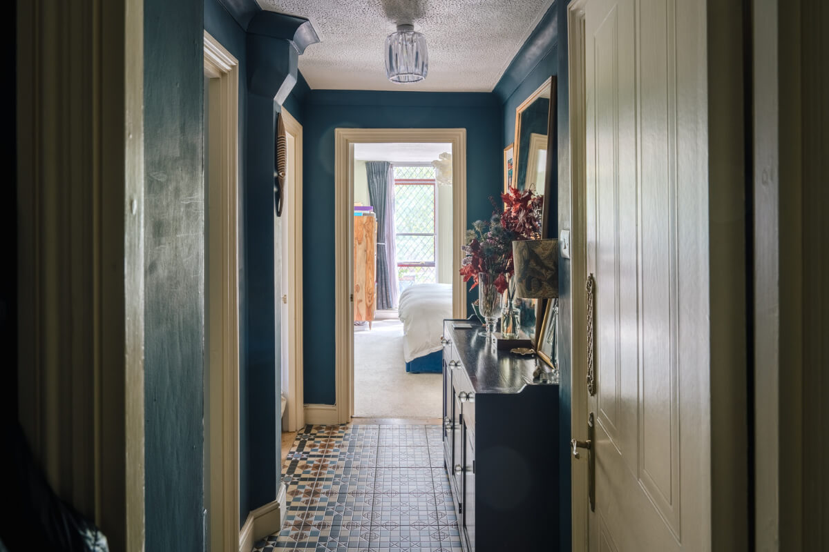A Colorful Apartment in a Former Victorian Church in London 8 blue hall colorful floor tiles