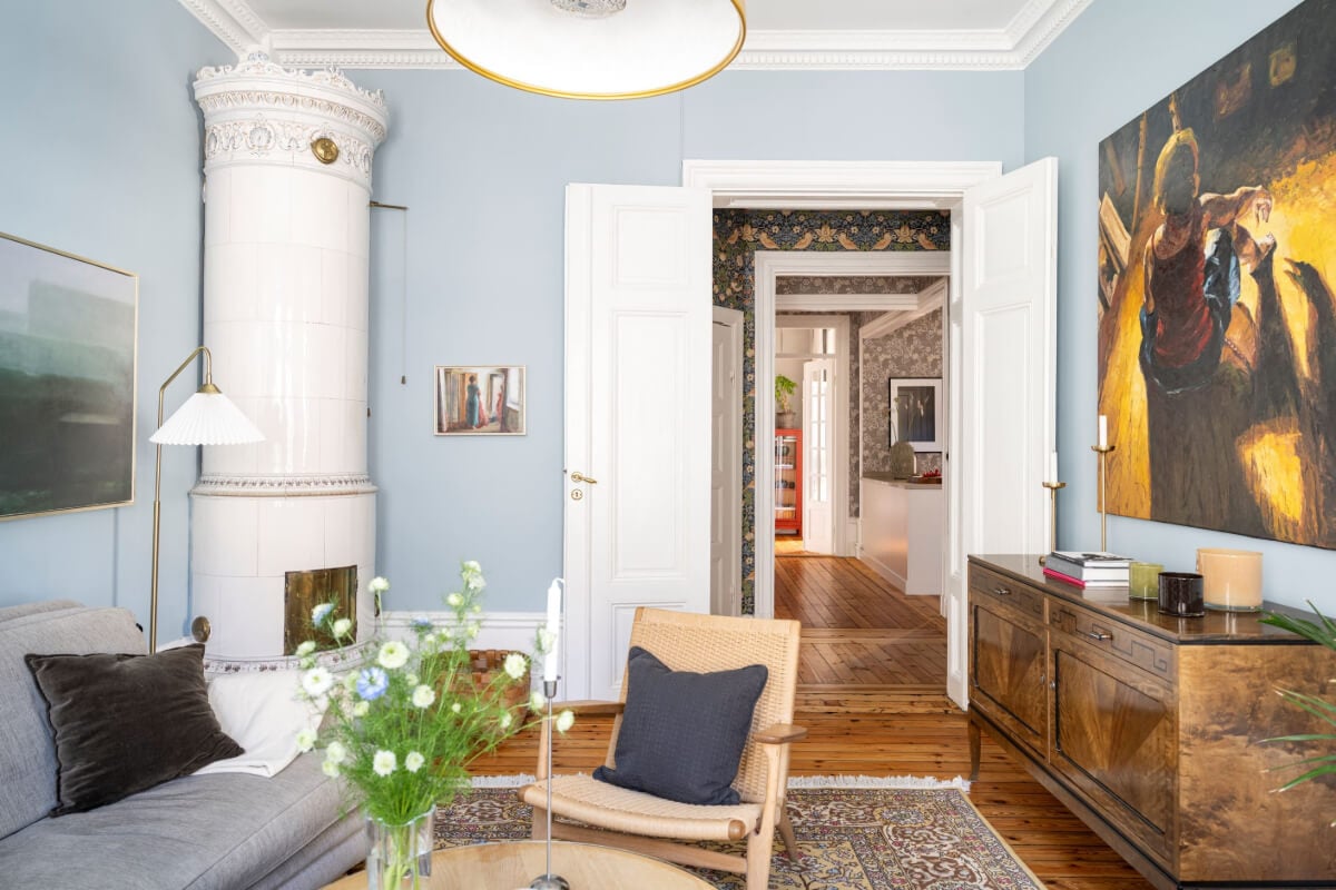 Wallpapers and Blue Tones in a Cozy Turn-of-the-Century Home 6 blue living room with fireplace