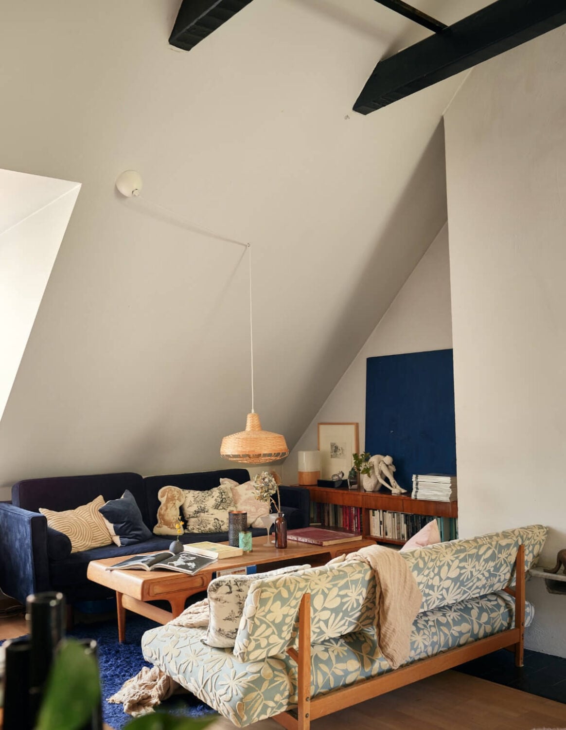 A Stunning Top-Floor Apartment with High Ceilings in a Former Church 16 blue sitting area slanted ceiling