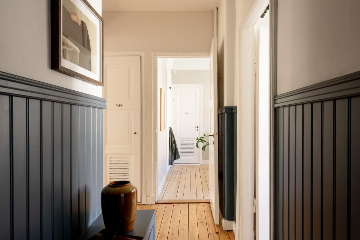 A Cozy Swedish Apartment with a Walk-In Pantry in the Sage Green Kitchen 18 blue tongue and groove paneling