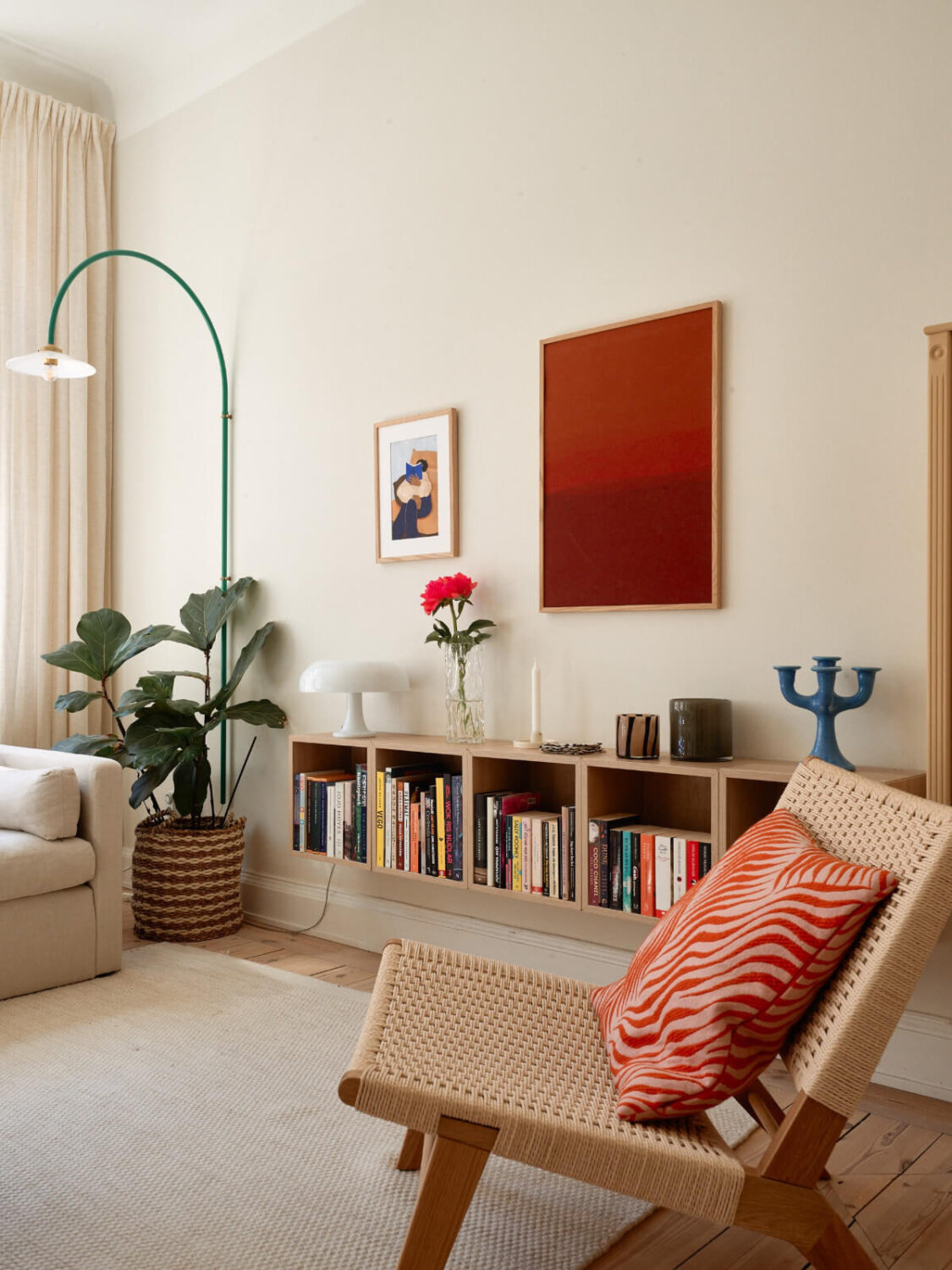 A Light-Filled Stockholm Apartment with Bright Color Pops 6 bookcase detail