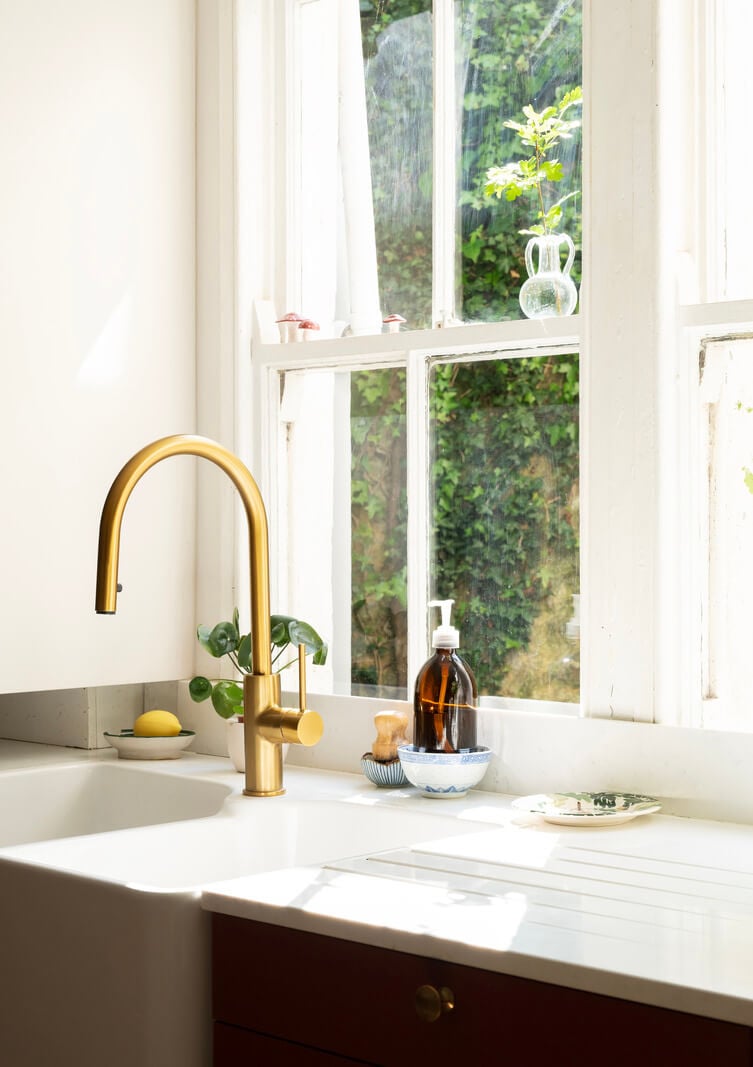 A Family Home with a Cheerful Color Palette in a Historic House 9 brass faucet kitchen sink