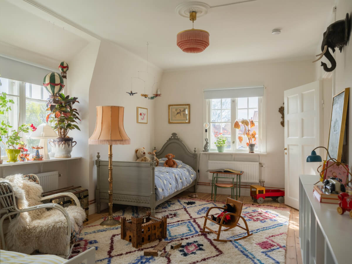 An Early 20th-Century Family Home Decorated with Color and Art 24 bright-kids-bedroom-large-windows-antique-bed