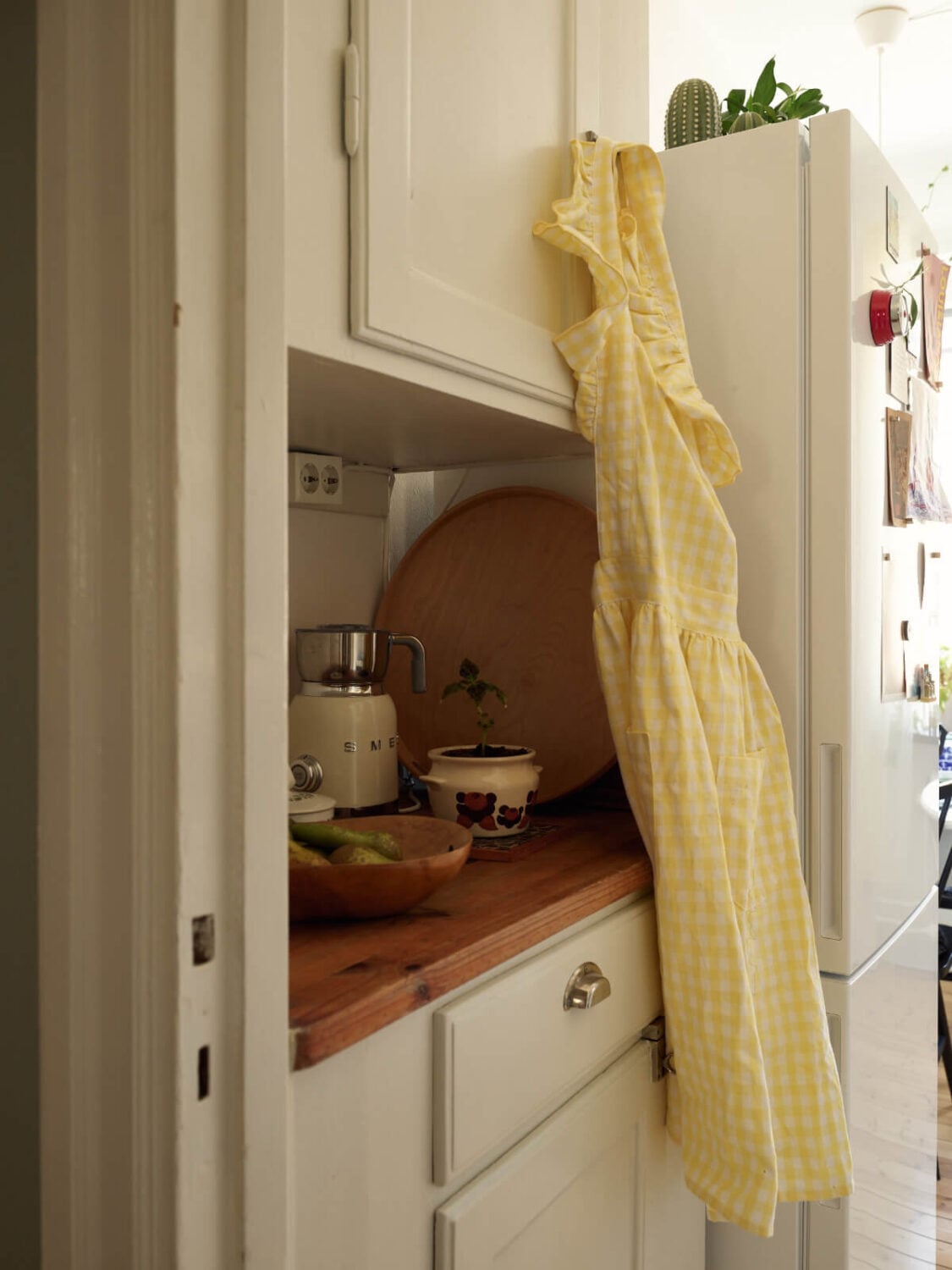 Warm Walls and Original Elements in a Swedish Studio Apartment 15 built in cabinets kitchen