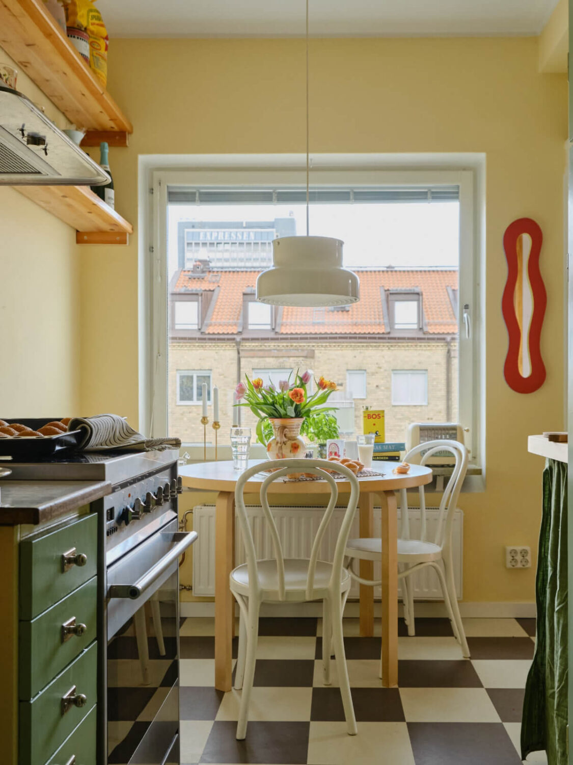A Colorful 1940s Apartment with Original Elements 14 butter yellow walls kitchen table