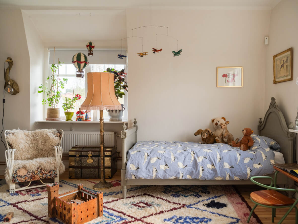 An Early 20th-Century Family Home Decorated with Color and Art 22 childrens room antique bedframe lamp