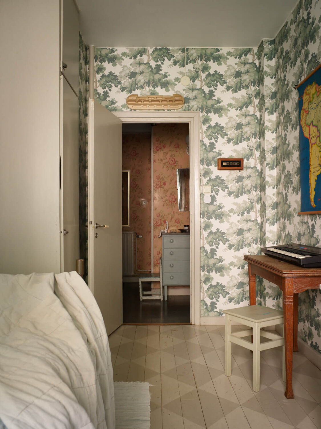 Wallpapers and a Midcentury-Style Kitchen in a 1930s Apartment 22 childrens room green wallpaper built-in wardrobes checkerboard pattern wooden floor