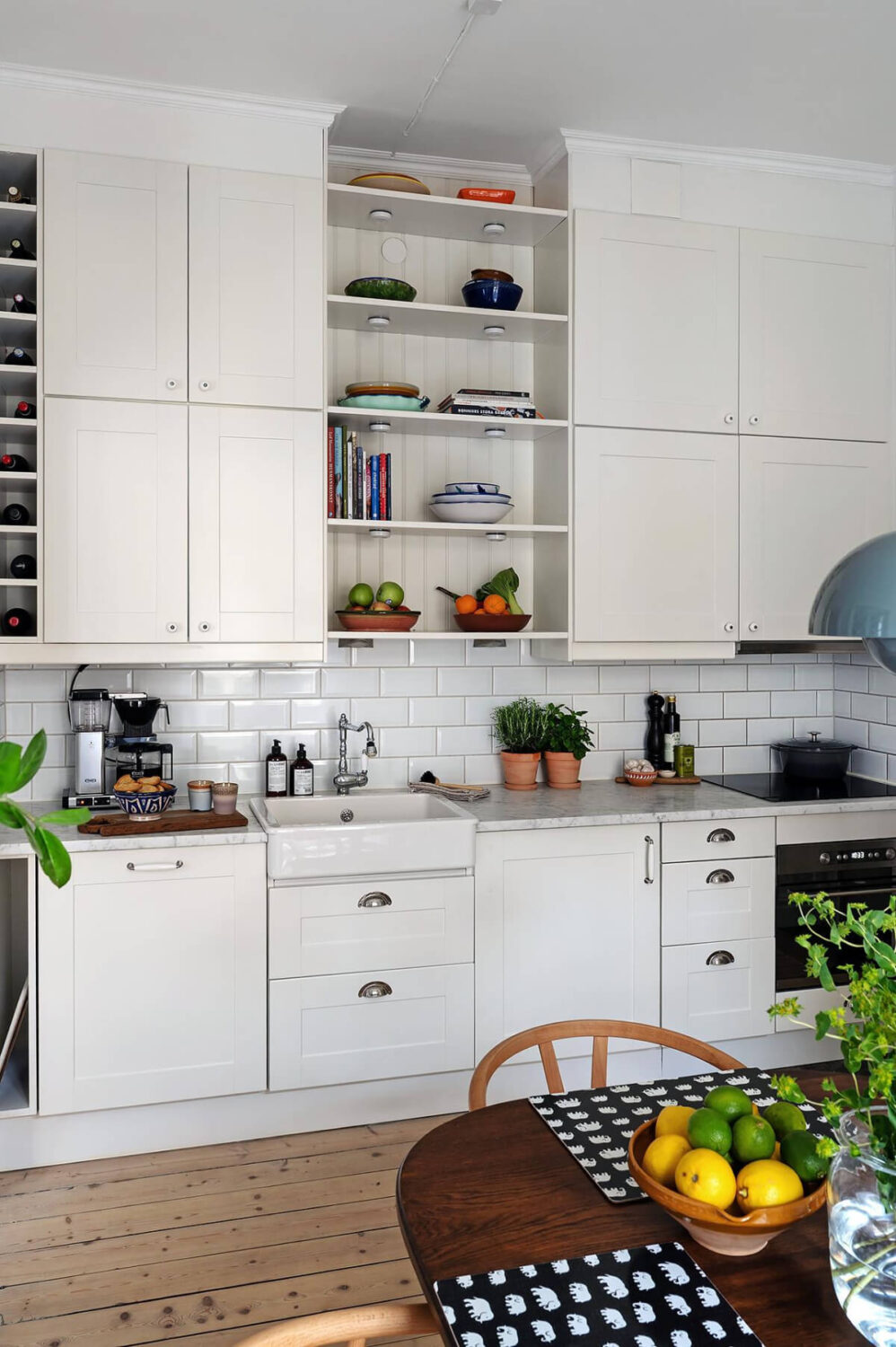Classic Elements in a Charming Swedish Studio Apartment 12 classic kitchen double row upper cabinets marble countertop