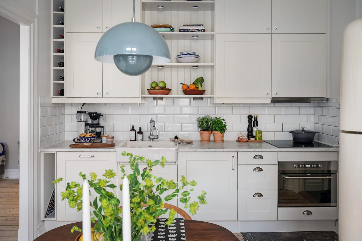 Classic Elements in a Charming Swedish Studio Apartment 15 classic kitchen marble countertop subway backsplash tiles