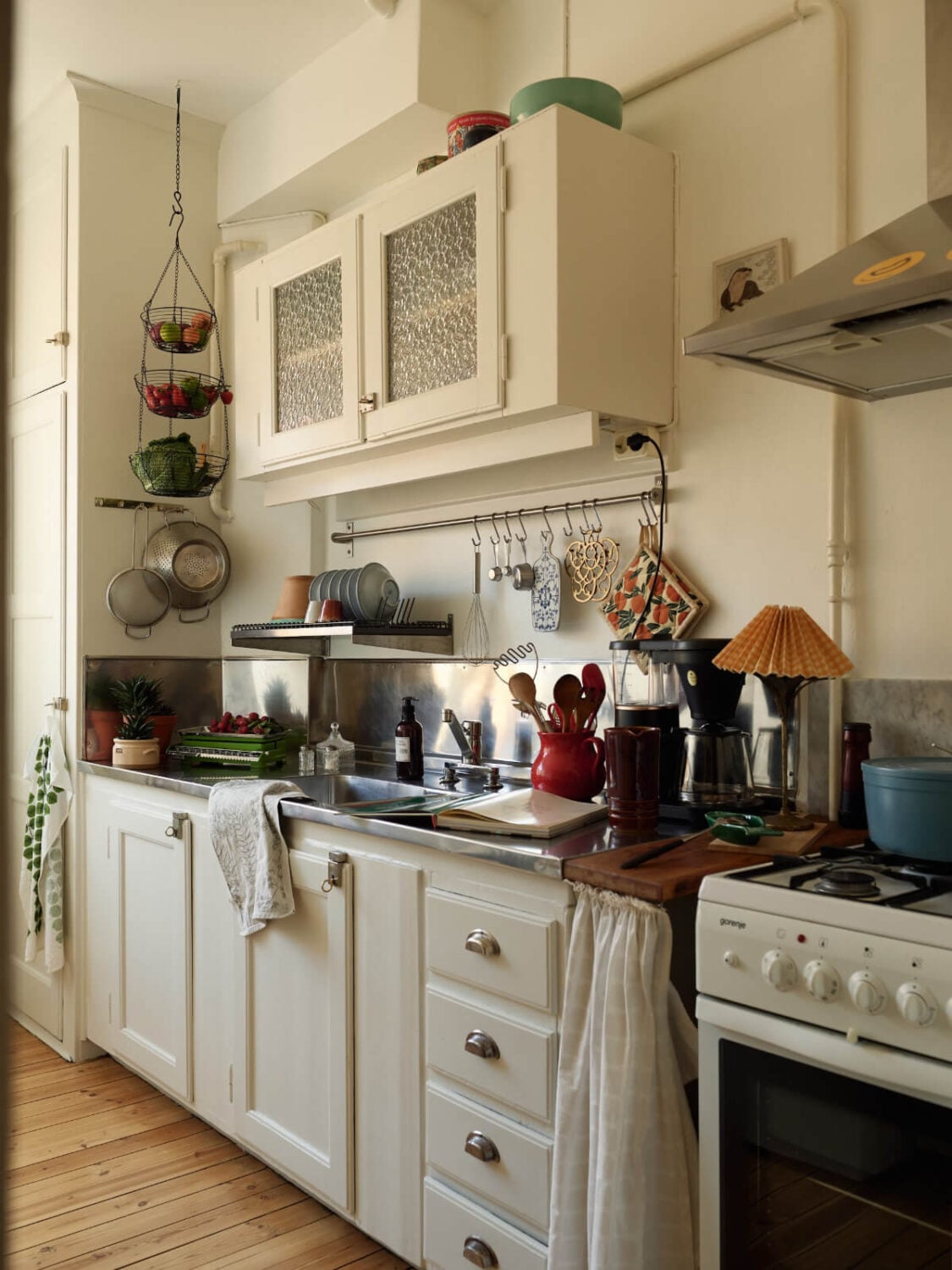 Warm Walls and Original Elements in a Swedish Studio Apartment 10 classic kitchen stainless steel countertop