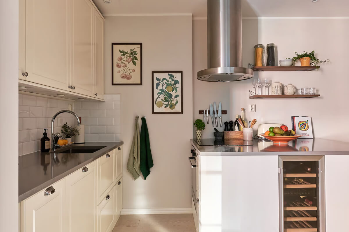 A Green Swedish Corner Apartment with an Open Floor Plan 17 classic white kitchen with island