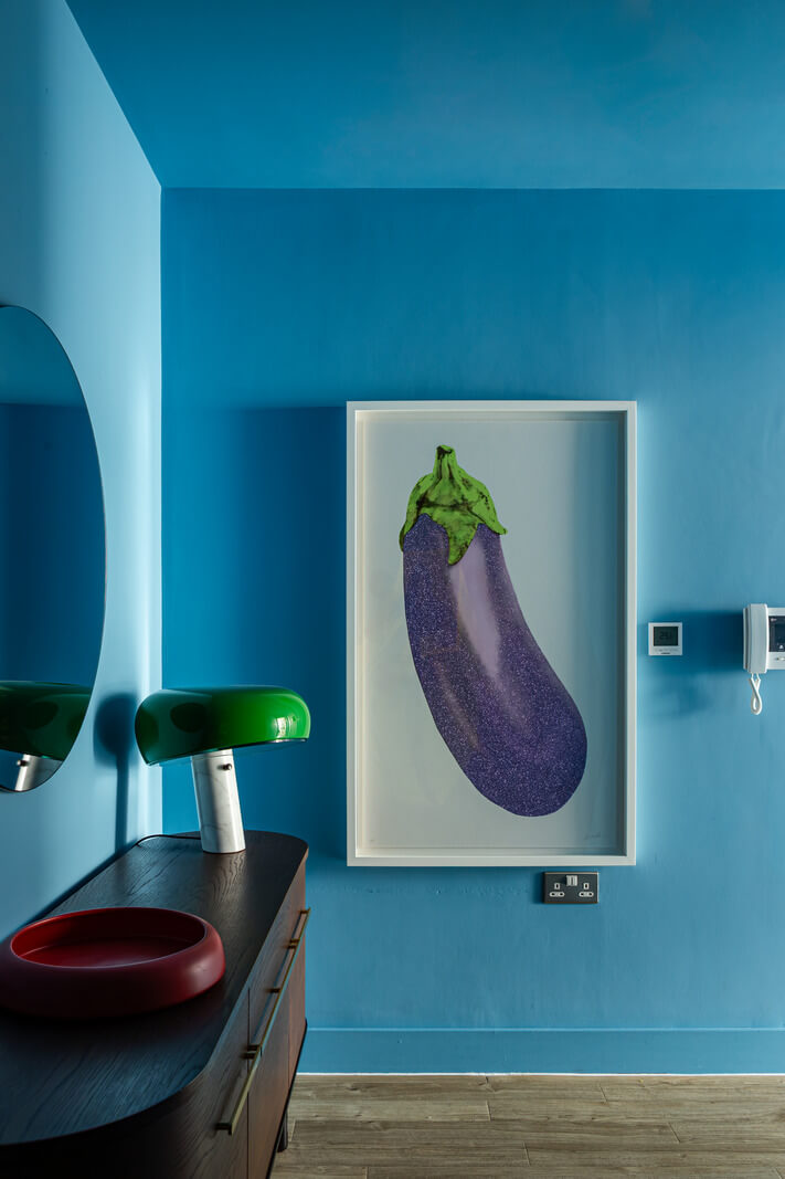 Playful Colors in a Modern One-Bedroom Apartment in London 16 color-drenched blue room