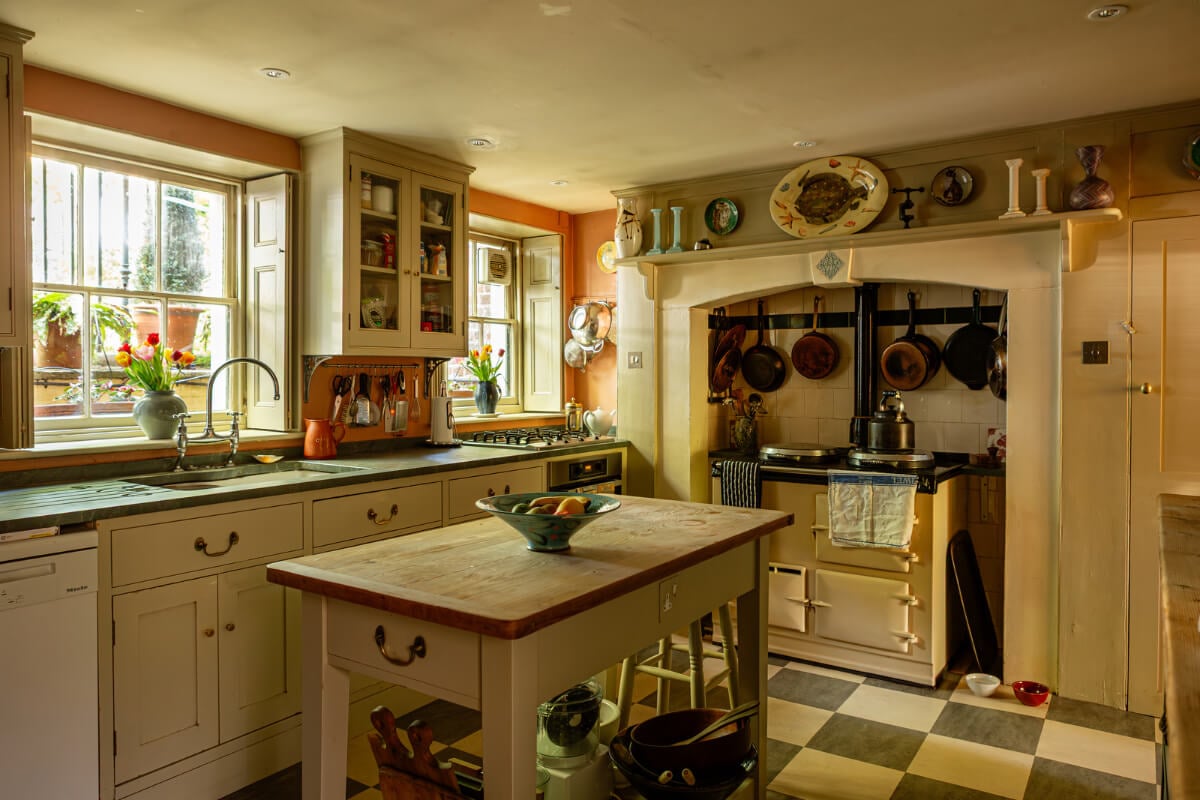 A Carefully Restored Georgian Townhouse in East London 7 cozy country-style kitchen checkerboard floor aga stove