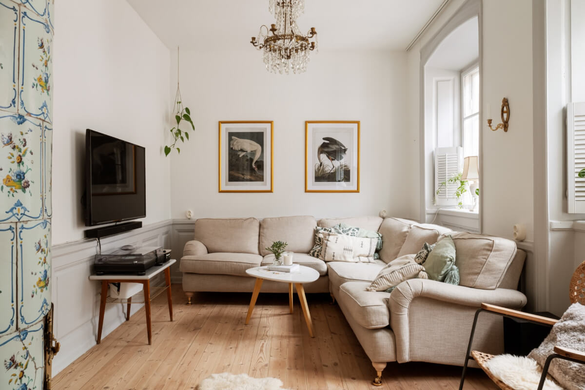 A Charming Attic Apartment in Stockholm's Gamla Stan 2 cozy light-colored living room wooden floor