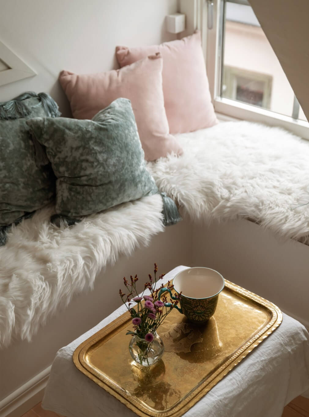 A Charming Attic Apartment in Stockholm's Gamla Stan 14 cozy window seat