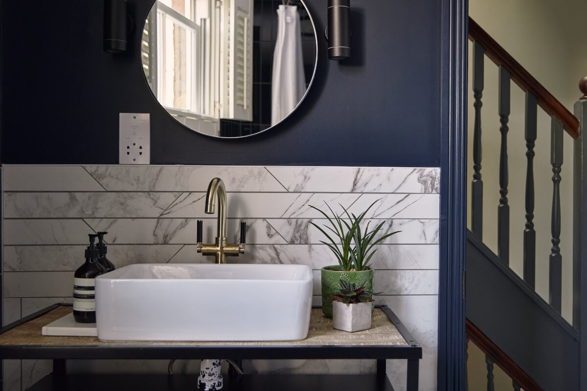 Moody Tones in a Restored and Extended Victorian Home in London 26 dark blue bathroom marble tiles
