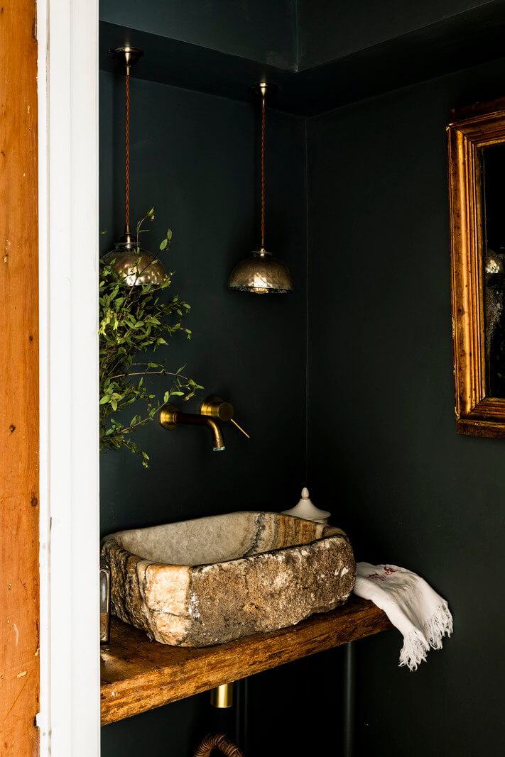 White-Washed Walls and Rustic Elements in a 17th Century Townhouse 18 dark powder room stone sink