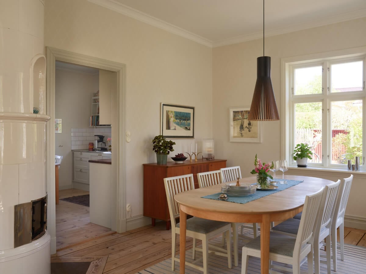 Light-Filled Rooms and Wallpapers in a Swedish Country House 9 dining room connected to kitchen