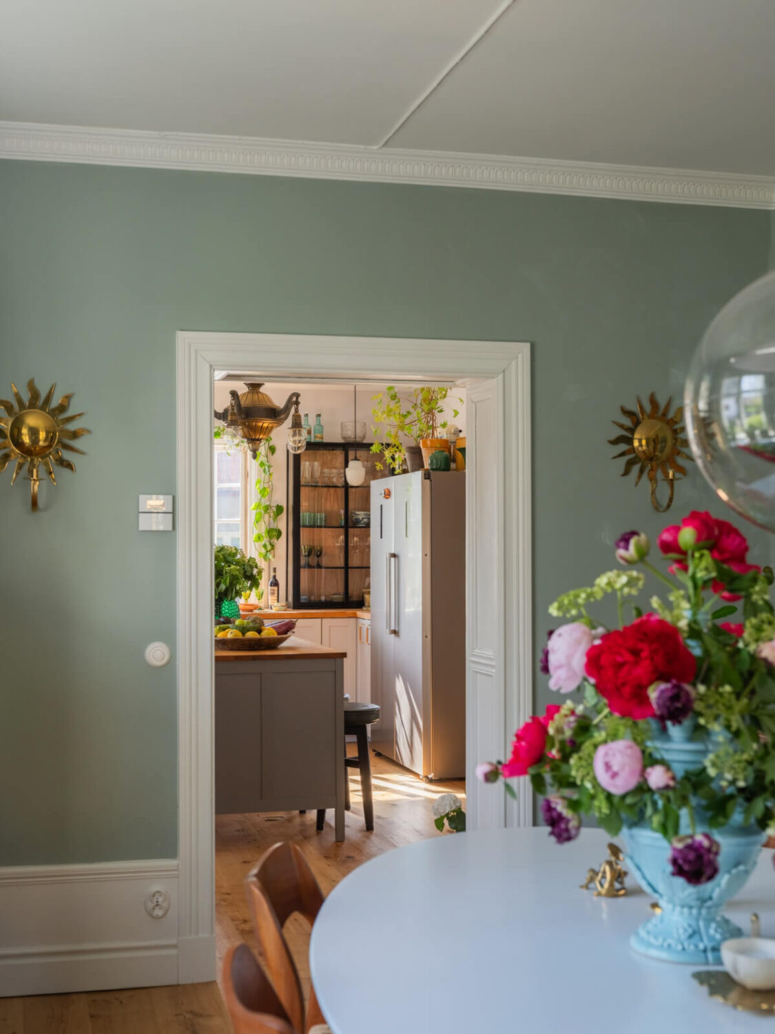An Early 20th-Century Family Home Decorated with Color and Art 8 dining room view into kitchen