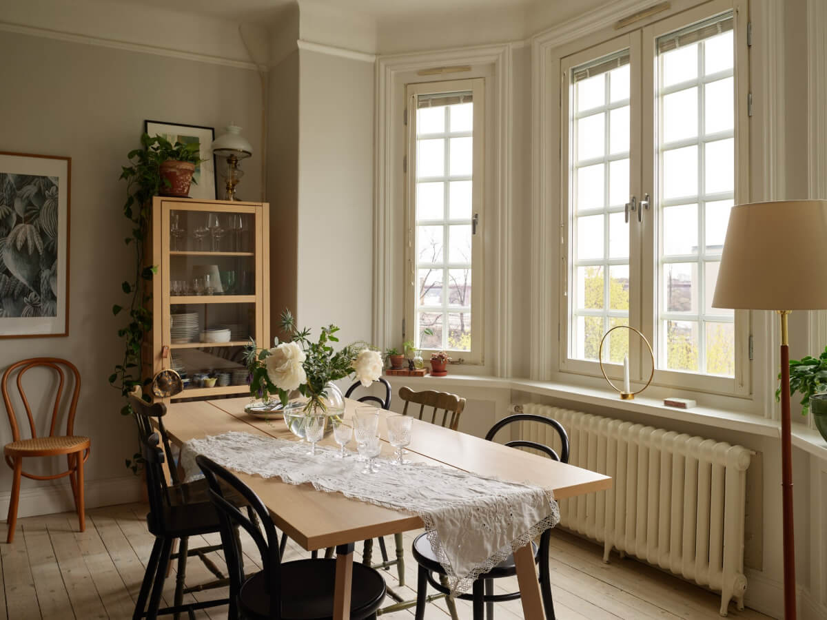 A Beautifully Renovated Early 20th-Century Apartment 3 dining table bay window
