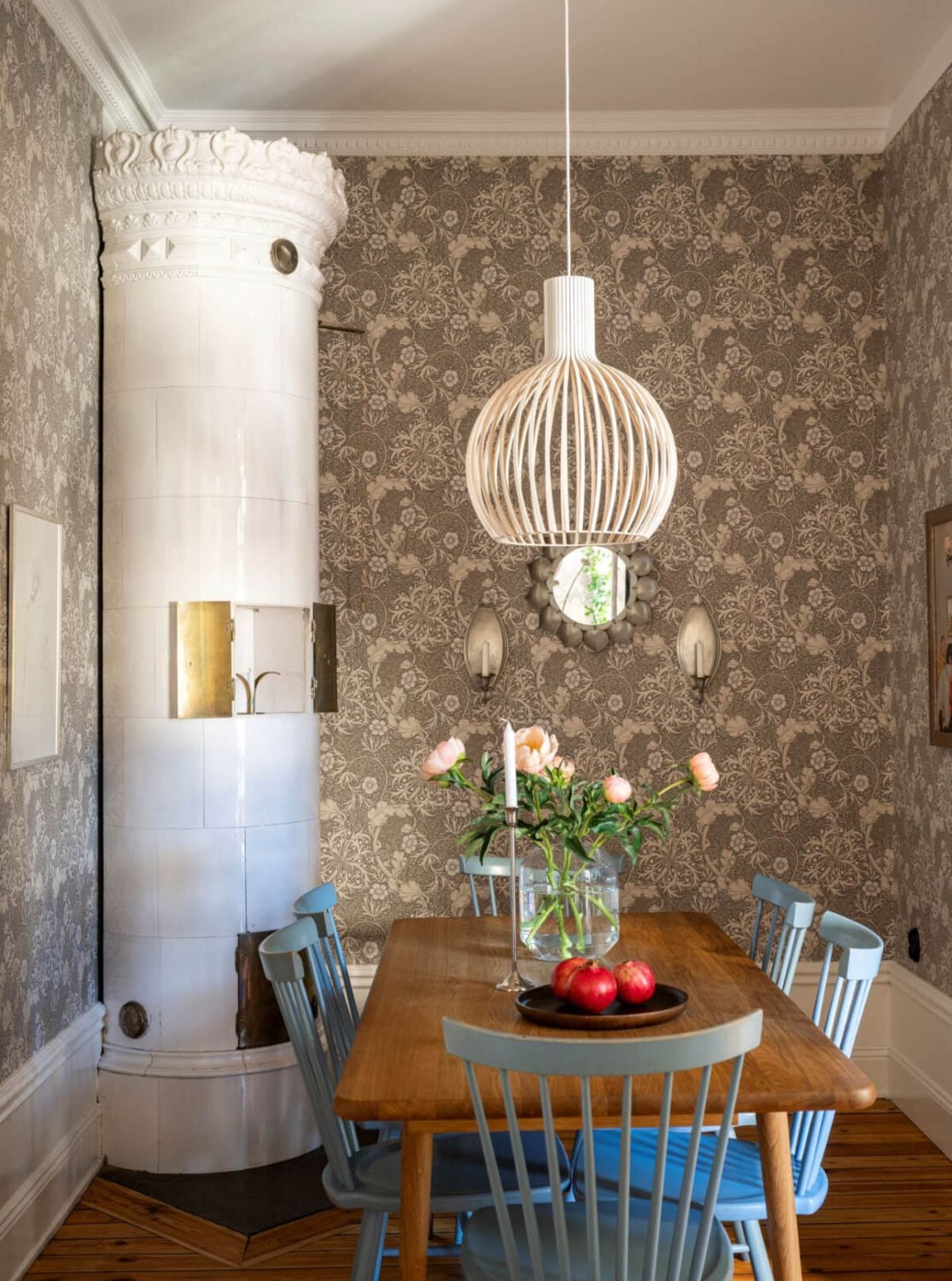 Wallpapers and Blue Tones in a Cozy Turn-of-the-Century Home 15 dining table blue chairs fireplace floral wallpaper