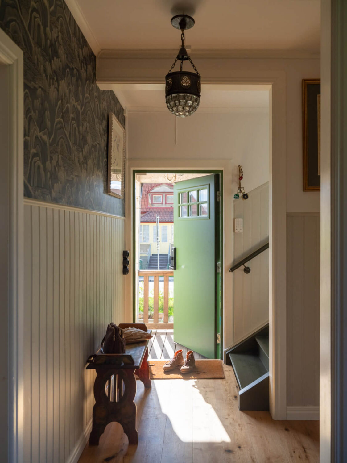 An Early 20th-Century Family Home Decorated with Color and Art 33 entry hall bench