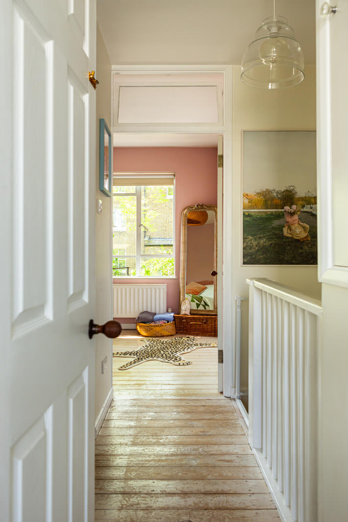 An Open-Plan Living Space and Colorful Bedrooms in a London Duplex 14 first floor landing rustic floorboards