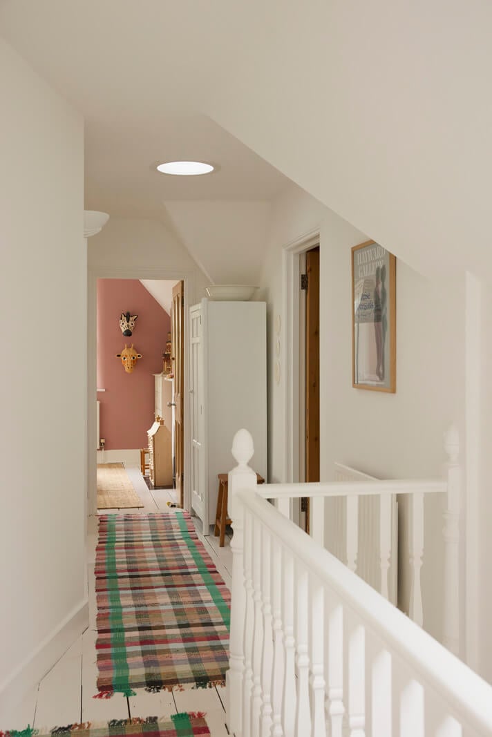 Natural Colors and Materials in a Beautiful Arts and Crafts House 29 first floor landing white-painted floorboards