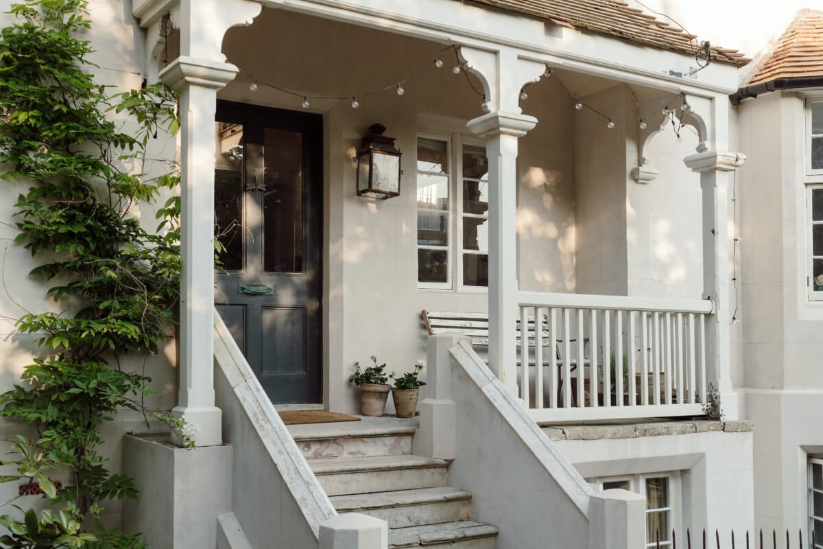 Grand, Light-Filled Spaces in a Gothic-Style English Coastal Home 33 front door porch