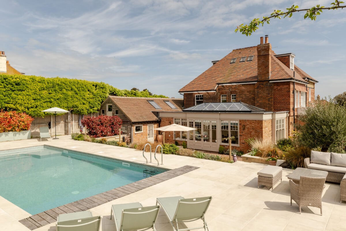 A Grand Edwardian Villa with a Yellow Kitchen and Coastal Views 32 garden with swimming pool