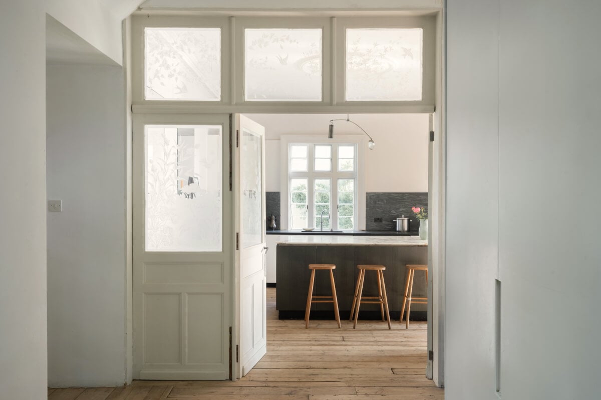 Grand, Light-Filled Spaces in a Gothic-Style English Coastal Home 6 glass doors into kitchen