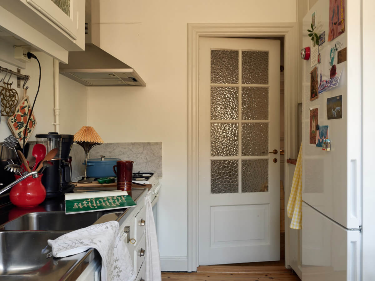 Warm Walls and Original Elements in a Swedish Studio Apartment 14 glass panes wooden door