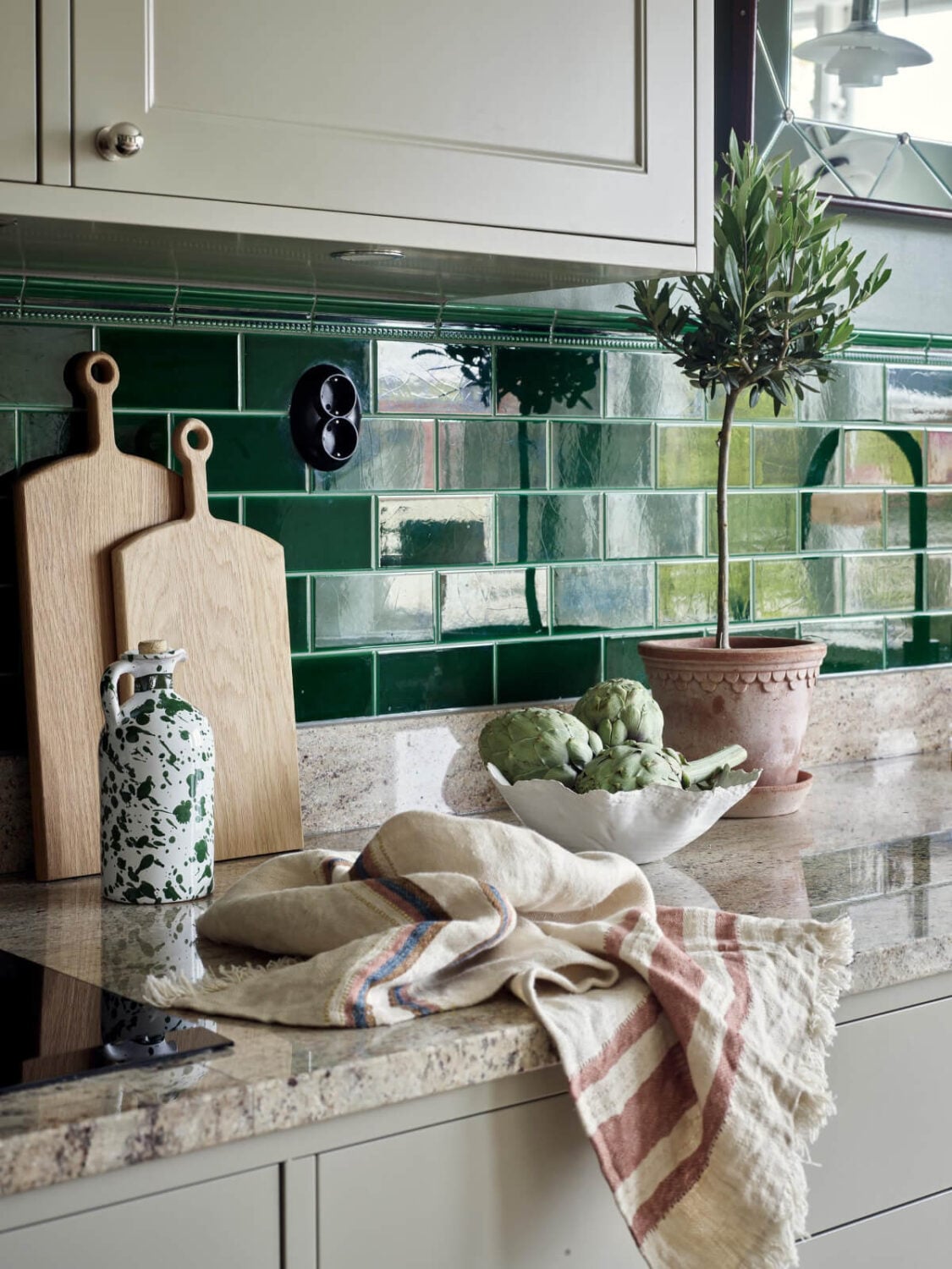 A Harmonious Color Palette in a Swedish Duplex Apartment 4 glossy green backsplash tiles A Harmonious Color Palette in a Swedish Duplex Apartment