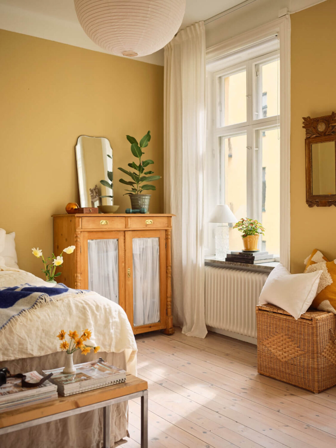 Best of 2025: Bedrooms 8 golden yellow walls bedroom wooden floorboards large windows nordroom